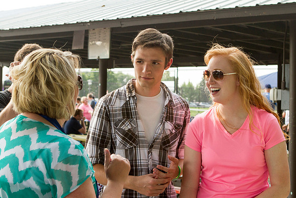 The IT Department, along with family and friends, gather at Porter Park to eat, socialize, and play games.
