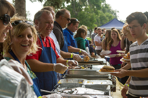 The IT Department, along with family and friends, gather at Porter Park to eat, socialize, and play games.