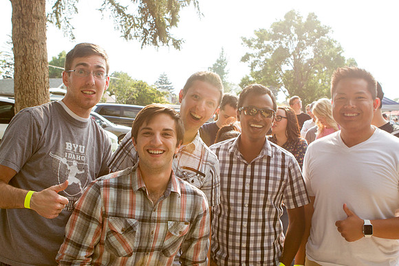 The IT Department, along with family and friends, gather at Porter Park to eat, socialize, and play games.