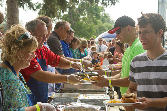 The IT Department, along with family and friends, gather at Porter Park to eat, socialize, and play games.
