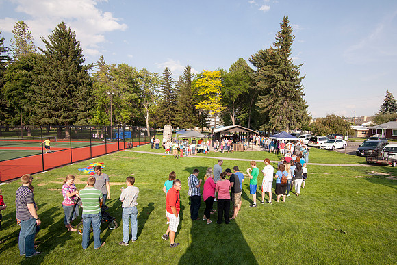 The IT Department, along with family and friends, gather at Porter Park to eat, socialize, and play games.