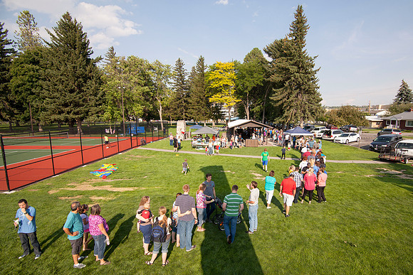 The IT Department, along with family and friends, gather at Porter Park to eat, socialize, and play games.