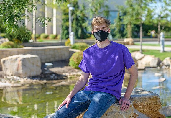 Student volunteers show the way to stay safe during this COVID 19 pandemic by social distancing, following pathway arrows and proper wearing of masks .