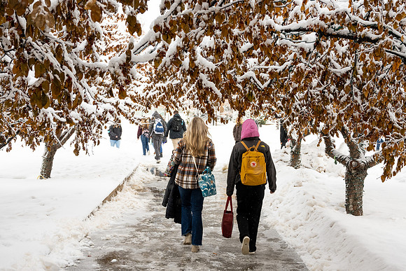 Students on campus on a snow winter day.
