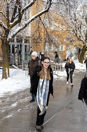 Students on campus on a snow winter day.