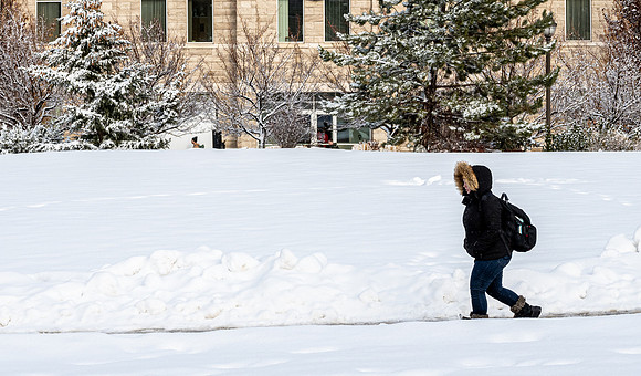 Students on campus on a snow winter day.