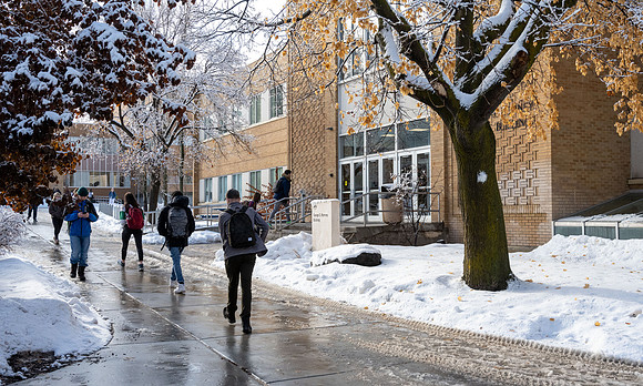 Students on campus on a snow winter day.