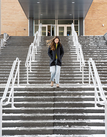 Students on campus on a snow winter day.