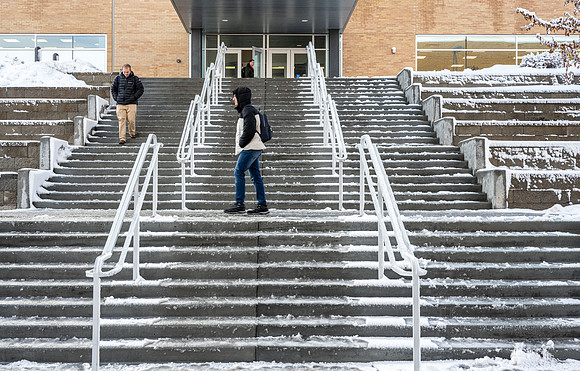 Students on campus on a snow winter day.