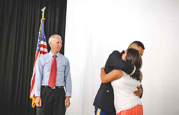 2LT Bloomfield receives gets his rank pinned on by his father Robert Bloomfield, and Tai-Lang, his sister.