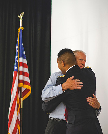 2LT Bloomfield hugs his father Robert Bloomfield, after getting his rank pinned on during the BYU-Idaho ROTC Commissioning Ceremony.