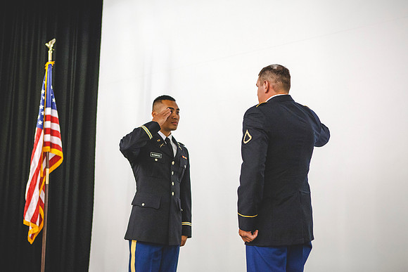 2LT Bloomfield renders his first salute to PFC Jacob McKie as an officer, during the Commissioning Ceremony.