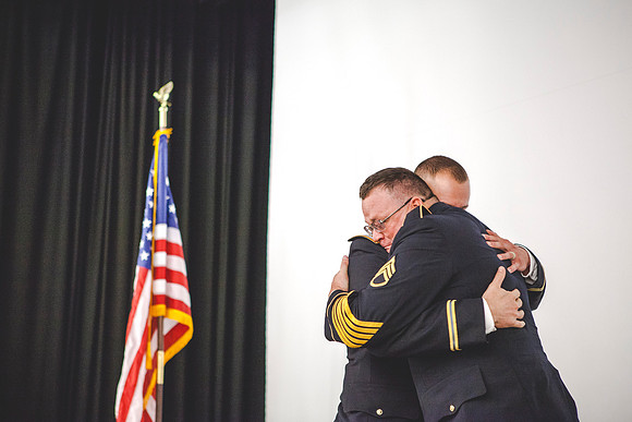 2LT Mathew Skyler Plummer hugs his uncle, SSG Tom Plummer, after giving him his first salute as an officer.