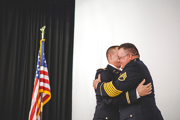 2LT Mathew Skyler Plummer hugs his uncle, SSG Tom Plummer, after giving him his first salute as an officer.