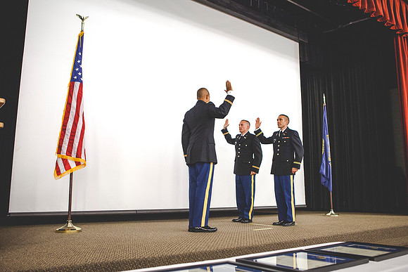 CPT Watkins swears in 2LT Geiger and Mars during the BYU-Idaho ROTC Commissioning Ceremony.