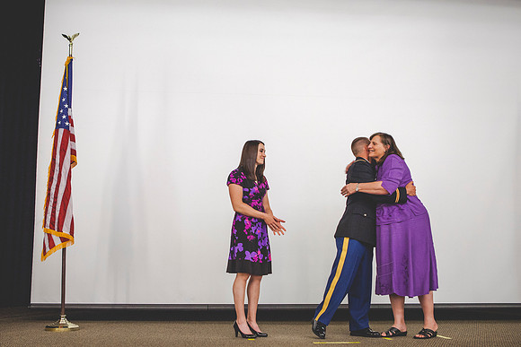 2LT Geiger gets his rank pinned on by wife and mother during the Commissioning Ceremony.