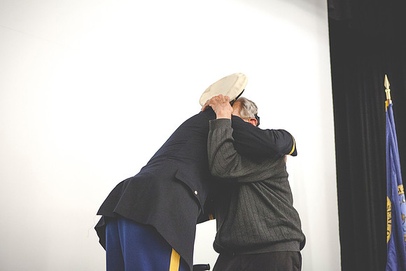 2LT John R. Flanigan gives his first salute to his grandfather Farnes Bruntsen, who served in the Navy during WWII.