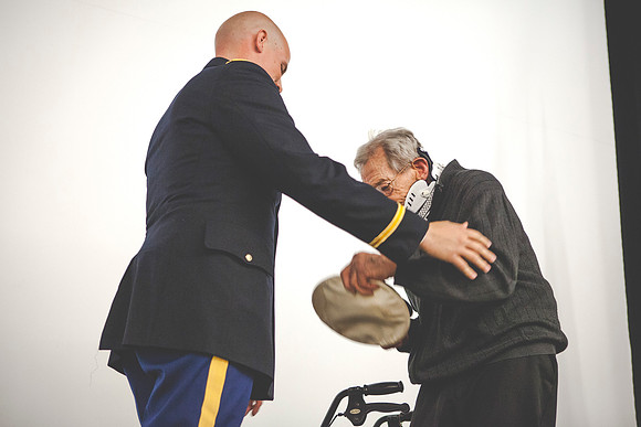 2LT John R. Flanigan gives his first salute to his grandfather Farnes Bruntsen, who served in the Navy during WWII.