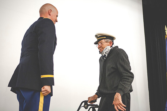2LT John R. Flanigan gives his first salute to his grandfather Farnes Bruntsen, who served in the Navy during WWII.