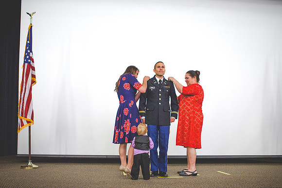 2LT Benjamin Mars gets his rank pinned on by his wife Hannah Mars and his mother during the Commissioning Ceremony.