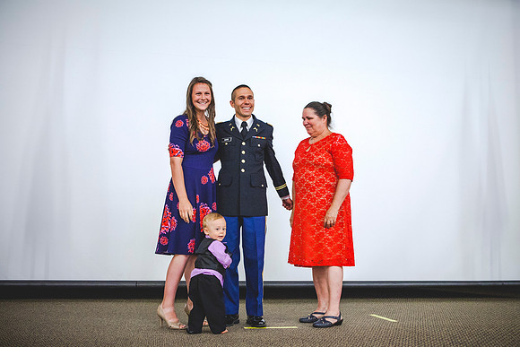 2LT Benjamin Mars gets his rank pinned on by his wife Hannah Mars and his mother during the Commissioning Ceremony.