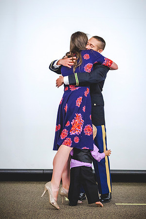 2LT Benjamin Mars hugs is wife Hannah, during the Commissioning Ceremony.