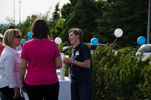 Online instructors gather with their families for an eveing of BBQ and games.