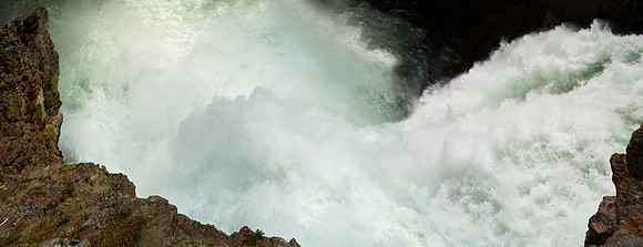 Panoramic close up view over the brink of Yellowstone Falls in the Grand Canyon of Yellowstone.`