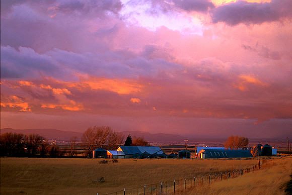 The evening sky lights up over a farm in southeastern Idaho.