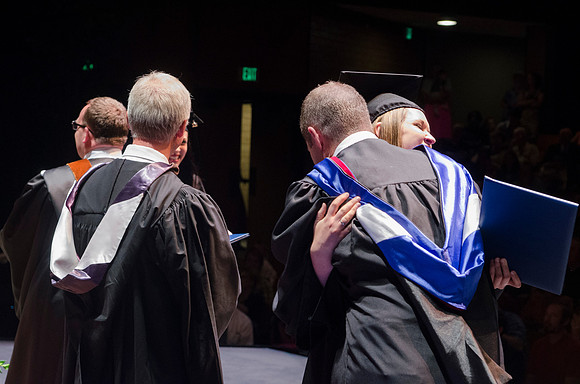 Dean's of the College of Performing and Visual Arts award diplomas to graduates during convocation held in the Snow Building.