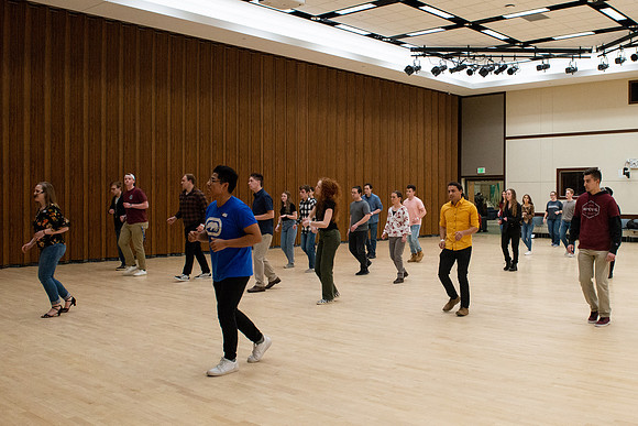 Students learn the basics of Bachata during the weekly social Latin Dance.