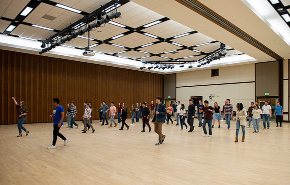 Students learn the basics of Bachata during the weekly social Latin Dance.
