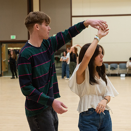 Students learn the basics of Bachata during the weekly social Latin Dance.