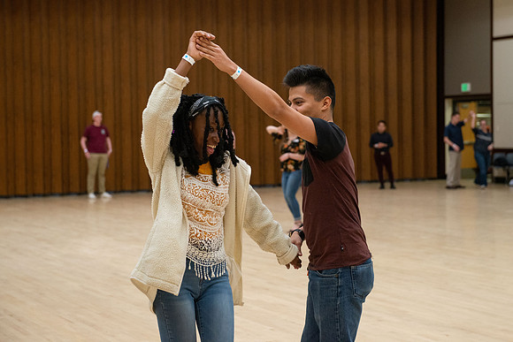 Students learn the basics of Bachata during the weekly social Latin Dance.
