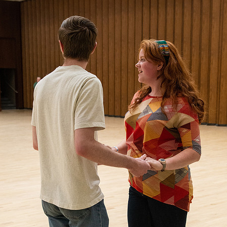 Students learn the basics of Bachata during the weekly social Latin Dance.