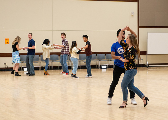 Students learn the basics of Bachata during the weekly social Latin Dance.