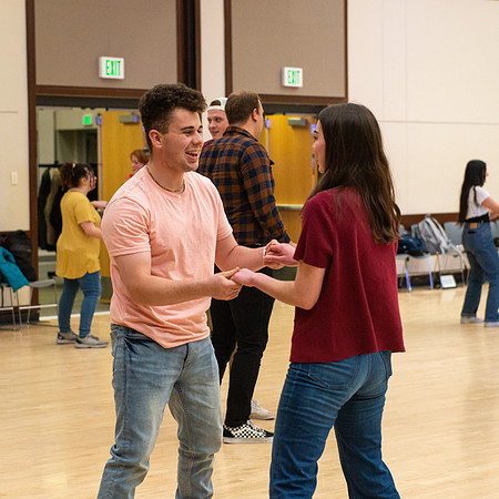 Students learn the basics of Bachata during the weekly social Latin Dance.