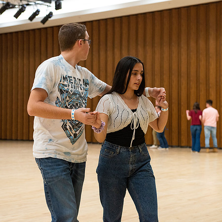Students learn the basics of Bachata during the weekly social Latin Dance.