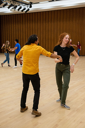 Students learn the basics of Bachata during the weekly social Latin Dance.