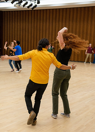 Students learn the basics of Bachata during the weekly social Latin Dance.
