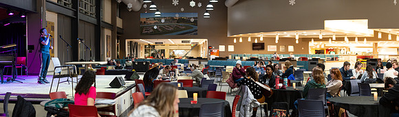 Students share their talents and perform during Open Mic Night in the MC Crossroads.