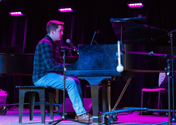 Students share their talents and perform during Open Mic Night in the MC Crossroads.