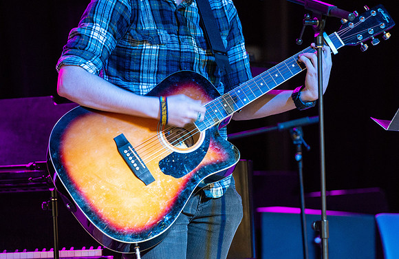 Students share their talents and perform during Open Mic Night in the MC Crossroads.