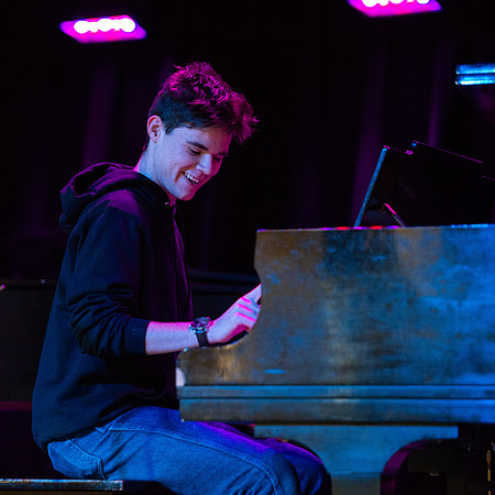 Students share their talents and perform during Open Mic Night in the MC Crossroads.