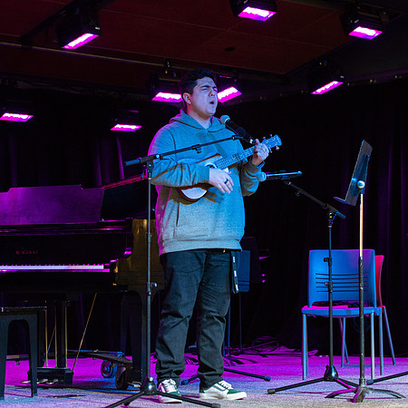 Students share their talents and perform during Open Mic Night in the MC Crossroads.