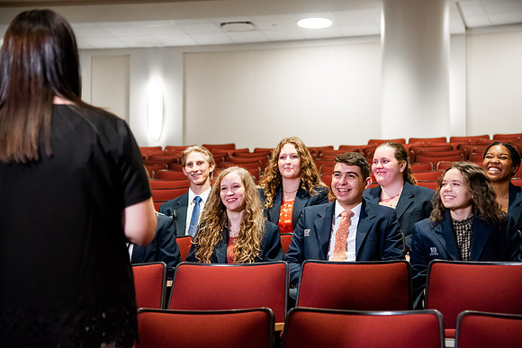 Ushers perform their duties in the I-Center to prepare for devotional. Used for an usher training video.