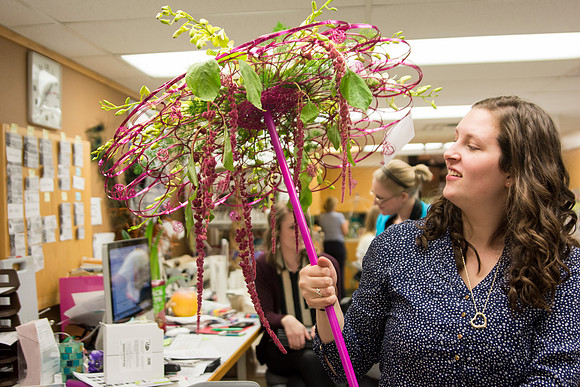 Horticulture students prepare for a semester review fashion show that will show their floral designs as well. Brother Romney leads the students along with other instructors.
