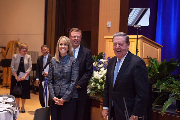 After a moment of silence, Elder Holland says to those gathered at the Luncheon, "Let me introduce you to President and Sister Gilbert." Photo by Tyler Rickenbach