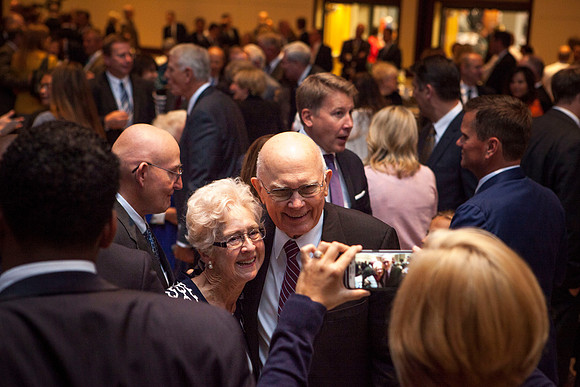 Elder Dallin H. Oaks, takes a picture with his former secretary, while he was president at Brigham Young University, during the Inaugural Luncheon. Photo by Tyler Rickenbach