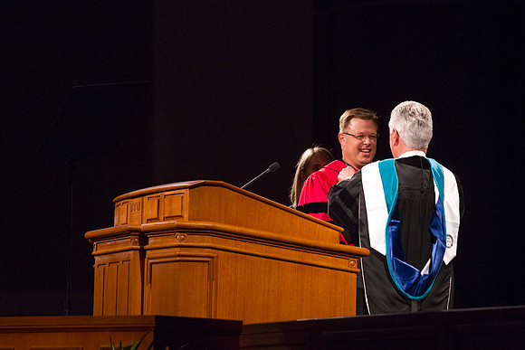 President Dieter F. Uchtdorf presents President Gilbert with a Presidential Medallion during the Inauguration Ceremony. Photo by Tyler Rickenbach